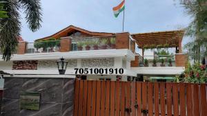 a house with a flag on top of it at Ashiana in Patiāla