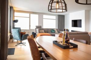 a living room with a table and a couch at Ferienwohnung Penthouse Feldberg in Feldberg