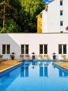 an image of a swimming pool in a house at Nykščio Namai & SPA in Anykščiai