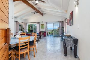 a dining room with a table and chairs at Blue Nautica Coastal Retreat in Ballito