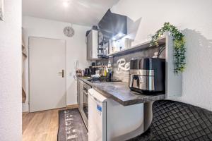 a kitchen with a counter with a coffee maker on it at Apartment Maja in Winterberg
