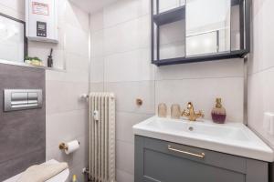 a bathroom with a sink and a mirror at Apartment Maja in Winterberg +12 photos