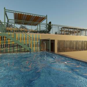 a view of a swimming pool with a fountain at Hôtel Le Joyau Bleu Hanoï in Hanoi