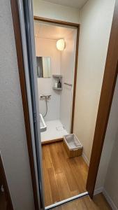 a small bathroom with a sink and a toilet at さくらやゲストハウス in Tokushima +13 photos