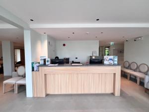 a salon with a counter with chairs in a room at Wyndham Garden Samui Wing in Chaweng +107 photos