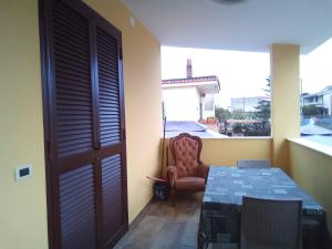 a room with a table and a chair and a window at Antiche Torri Guest House in Castel Volturno +47 photos