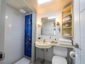 a bathroom with a sink and a toilet and a mirror at BV House in Incheon +33 photos