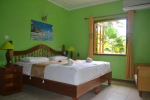 Postel nebo postele na pokoji v ubytování Villa Creole + 106 fotografií