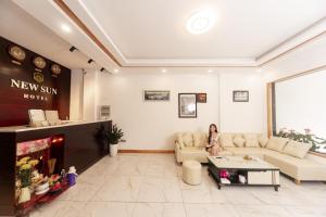 a woman sits in a waiting room at a new skin store at New Sun Hotel in Da Lat