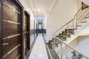a hallway with stairs in a building at Super Collection O Sindhi Camp Formerly Hotel Abhinandan Inn in Jaipur