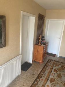 an empty room with a door and a dresser at Evelyn in Emmelshausen