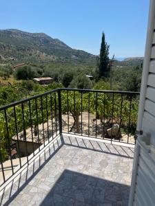 a balcony with a view of the mountains at Templa in Himare