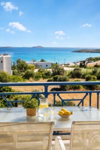 a table with a view of the beach and the ocean at Villa Zefiros in Kipri