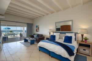 a bedroom with a bed with a view of the ocean at Bentley on the Beach in Umhlanga +71 photos