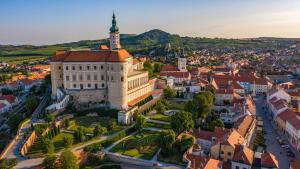 an aerial view of a city with a large building at Apartmán Mia in Mikulov