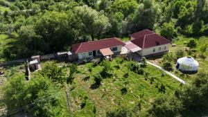 an aerial view of a house with a yard at ASAN ATA Guest House in Toktogul
