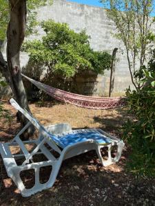 a hammock sitting in a yard next to a tree at Zadar Sunhouse Studio with Terrace in Zadar