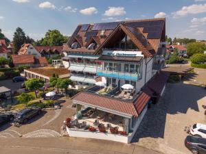 an overhead view of a building with solar panels on it at Hotel Meschenmoser in Langenargen