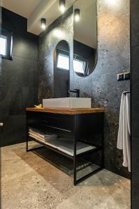 a bathroom with a sink and a mirror at Loftowe Zacisze in Bystra +43 photos