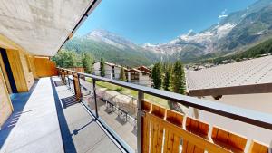 a balcony with a view of the mountains at Alphubel PEAK in Saas-Fee
