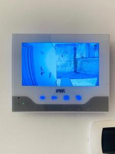 a flat screen tv hanging on a wall at Antigua 22 in Monopoli