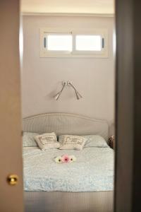 a bedroom with a bed with flowers on it at La Terrazza Bella Sicula in Furci Siculo +37 photos