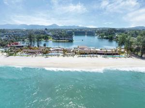 an aerial view of a resort on a beach at Angsana Oceanview Residences in Laguna by Banyan Living in Bang Tao Beach