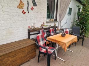 a table and chairs sitting on a patio at Hennickes Fewo in Friedrichshof