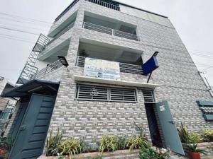 a building with a blue door at DVM Transient Inn by RedDoorz in Santo Tomas +11 photos