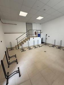 a large room with a gym with a staircase in it at Penzion Klas in Měřín +5 photos