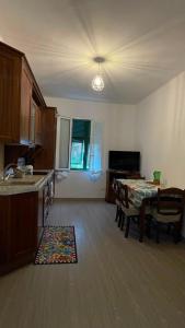 a kitchen with a table and a dining room at Ca' di Miglietto in Varigotti