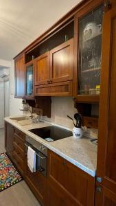a kitchen with wooden cabinets and a counter top at Ca' di Miglietto in Varigotti