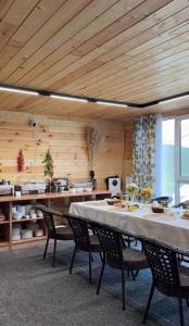 a dining room with a table and chairs at Son-Kul A-Frame & Yurt Camp in Song-Kul +43 photos