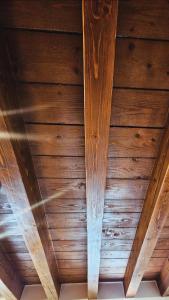 a ceiling of a room with wooden ceilings at Antica Dimora Confine in Mira