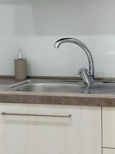 a kitchen sink with a faucet on a counter at Tra 2 Blu Guest House in Belvedere Marittimo +60 photos