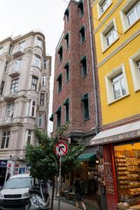 a street with tall buildings and a no right turn sign at D-orients in Istanbul