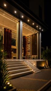 a building with a bunch of steps in front of it at night at فندق أروف Aroov Hotel in Taif