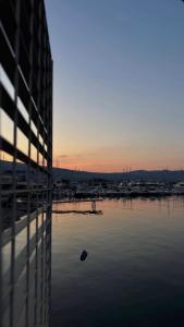 a view of a body of water at sunset at Faraglioni Bay in Acitrezza +7 photos