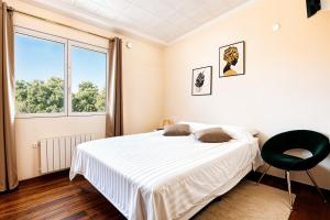 a bedroom with a bed and a large window at Villa de Golf Hoyo 19 in Busot +26 photos