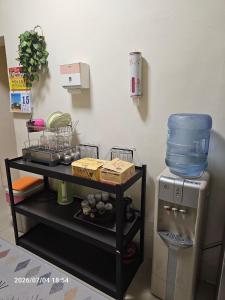 a kitchen with a table with a blender on top at Ajuan Homestay in Hengchun South Gate