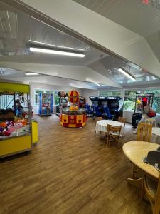 a childrens play room with a table and chairs at 87 Loch Murray in Creetown