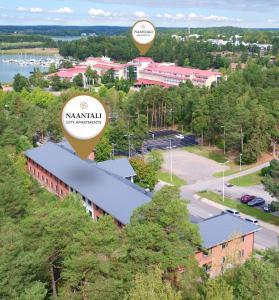 an aerial view of a town with buildings and trees at Naantali City Apartments in Naantali