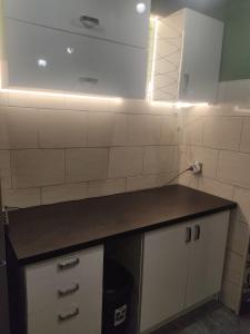 a kitchen with a counter top in a room at Second&Home 3 in Kalisz
