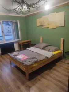 a bedroom with a bed in a room at Second&Home 3 in Kalisz