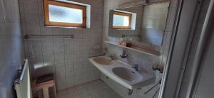 a bathroom with a sink and a mirror at Haus Jirka in Nauders