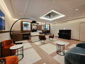 a living room with a couch and chairs and a table at Atlante Garden Hotel in Rome