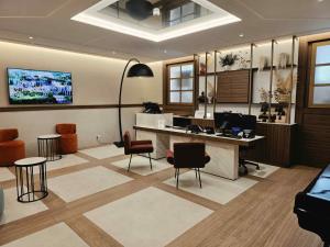 an office with a desk and chairs in a room at Atlante Garden Hotel in Rome