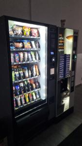 a vending machine filled with drinks and soda at Ubytovanie FUNSTAR Topoľčany in Topoľčany