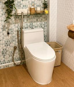 a bathroom with a white toilet in a room at blissful well treat in Ban Madua Wan +10 photos