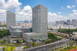 an aerial view of a city with tall buildings at Four Points by Sheraton Hangzhou, Binjiang in Hangzhou